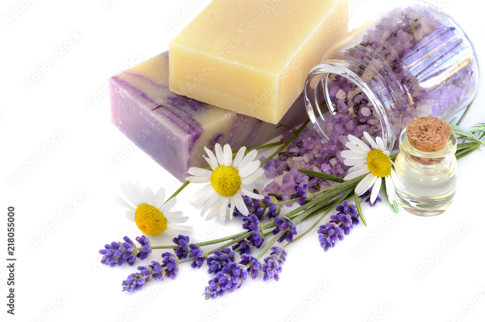 Spa products with lavender and chamomile flowers on a white background Spa products with lavender and chamomile flowers on a white background