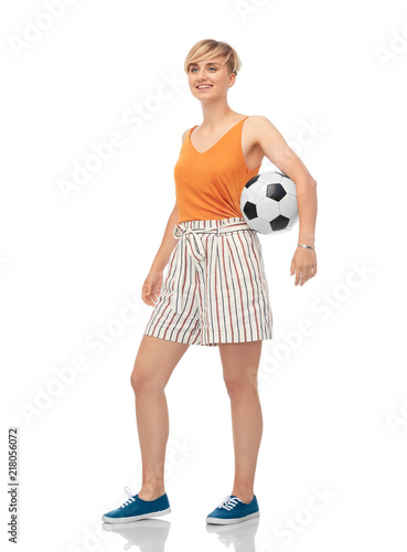 sport, leisure and people concept - smiling teenage girl with soccer ball over white background
