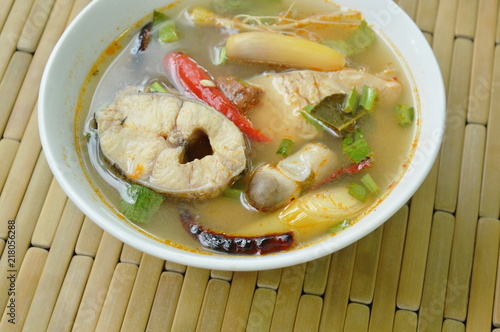 spicy boiled snake head fish and straw mushroom in tom yum soup on bowl