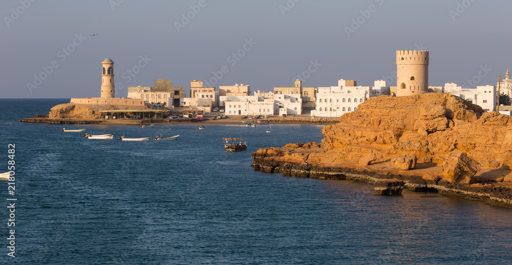 Watchtower and lighthouse in the bay of Sur, Oman