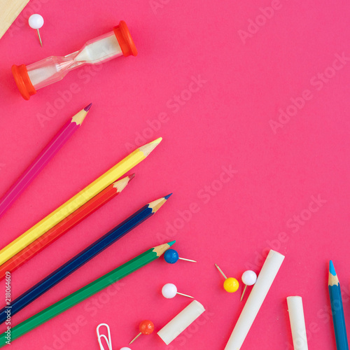 School and office supplies on pink background, top view. Back to school. Flat lay, copy space.