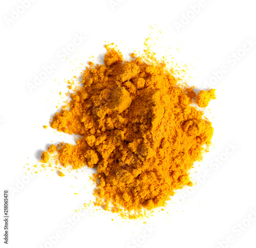 Turmeric (Curcuma) powder pile isolated on white background, top view.