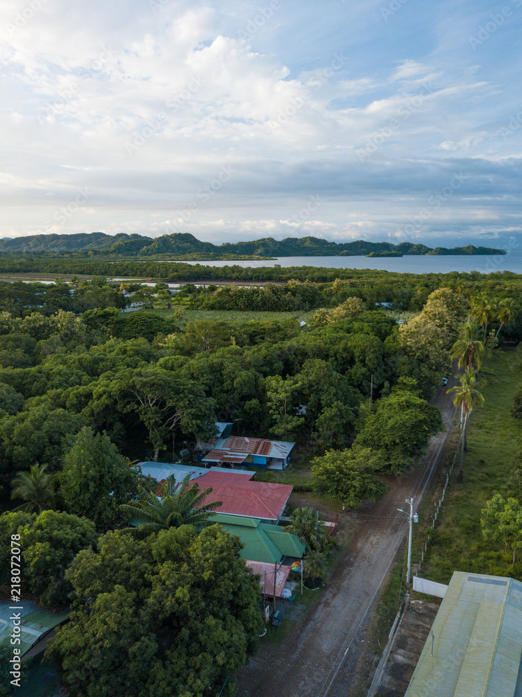 Obraz premium Rural Farms and the green lush jungle around Paquera Costa Rica captured via Drone