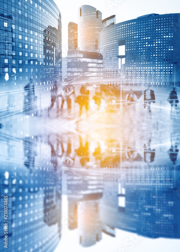Silhouettes of people walking in the street near skyscrapers and modern office buildings in Paris business district. Multiple exposure blurred image. Economy, finances, business concept illustration