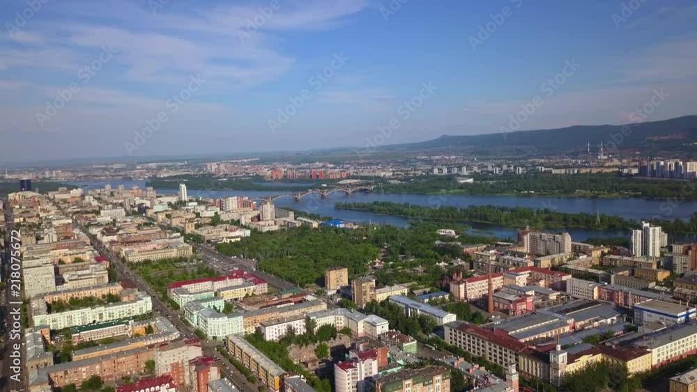Panoramic view of Krasnoyarsk city with bridge over river Yenisei drone footage Panoramic view of Krasnoyarsk city with bridge over river Yenisei drone footage