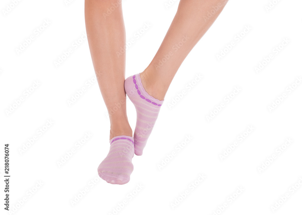 Female feet in cotton socks. Isolated on white background