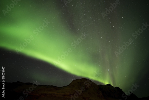 Aurora borealis and Hrafnatindar mountain at Vik campground Iceland