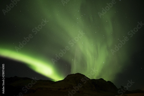 Aurora borealis  and Hrafnatindar mountain at Vik campground Iceland © Napatsan
