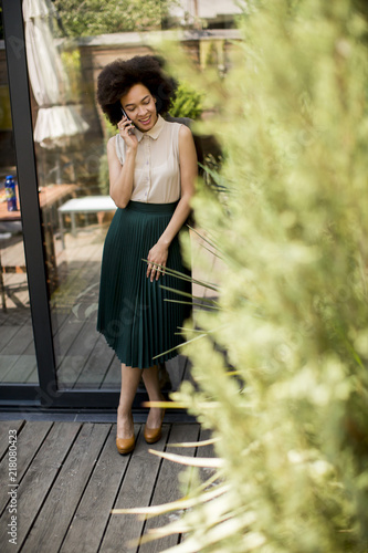 Curly hair cheerful woman u...