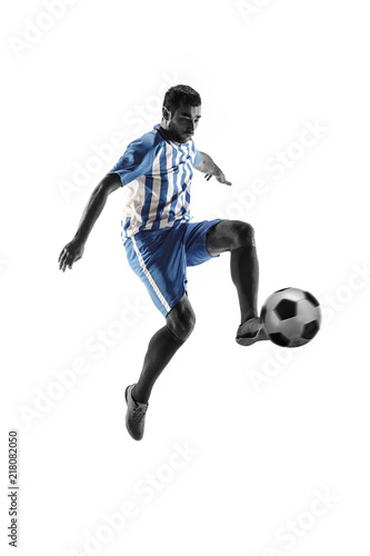 Professional football soccer player with ball isolated on white studio background © master1305