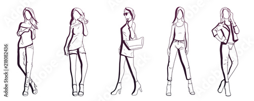 Set of hand drawn stylish beautiful women in different dress. Fashion model posing. Sketch.