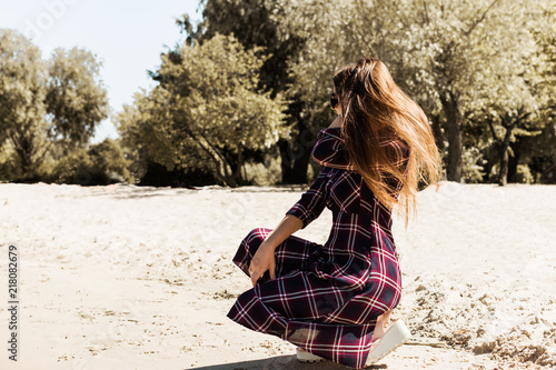 Pretty girl with long hair walking on the sea beach. Relaxation. Seascape. © Inna Dodor