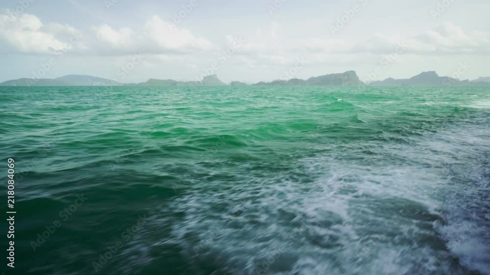 View of the waves in the sea from a ferry boat sailing on a sunny summer day. 4k View of the waves in the sea from a ferry boat sailing on a sunny summer day. 4k