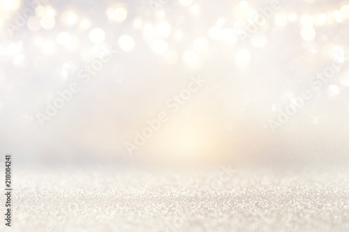 glitter vintage lights background. silver and light gold. de-focused. © tomertu
