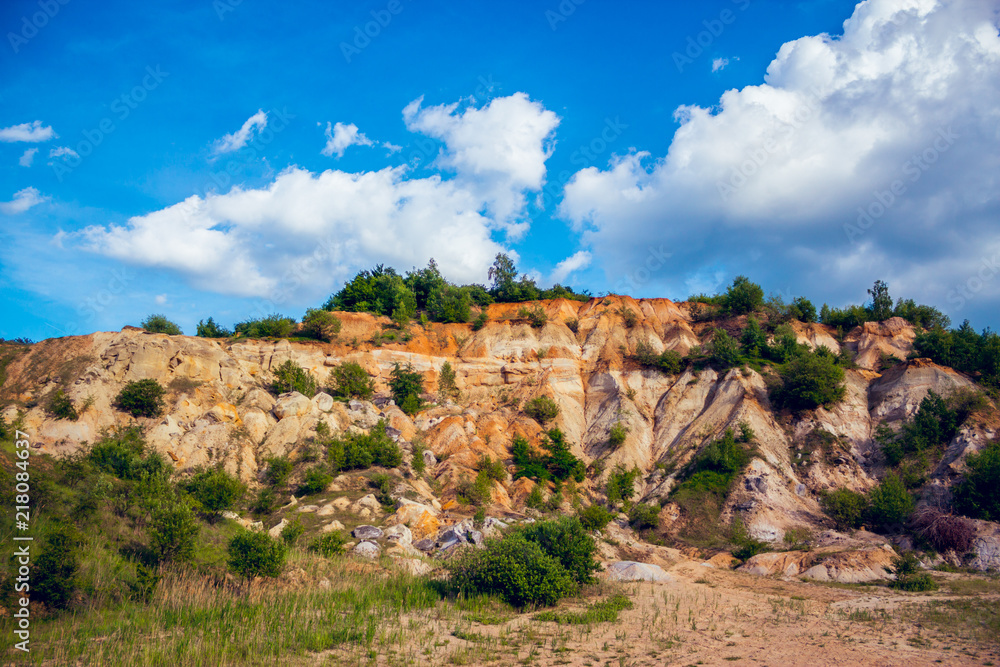 Eroded limestone rock hill with landslides