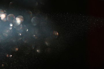 glitter vintage lights background. gold and silver. de focused.
