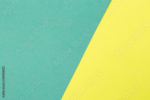 Yellow and turquoise color texture paper background. Geometric paper background.