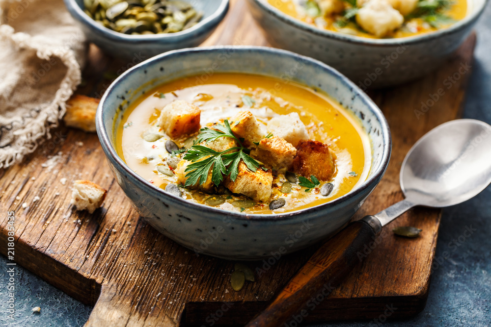 Pumpkin and carrot soup with cream and parsley. Pumpkin and carrot soup with cream and parsley.