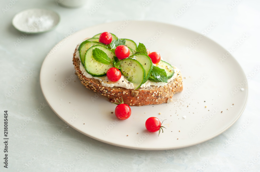 A Mediterranean twist on bruschetta with cream cheese, mint, cucumber and mini tomatoes. A Mediterranean twist on bruschetta with cream cheese, mint, cucumber and mini tomatoes.