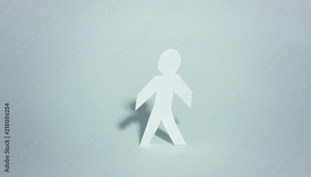 cardboard man on a paper background. background. cardboard man on a paper background. background.