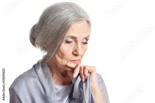 Sad senior woman isolated on white background