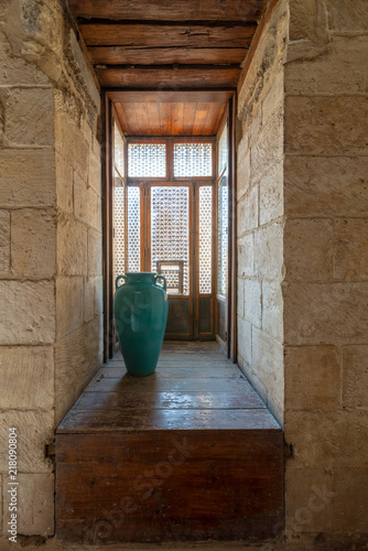 Recessed interleaved wooden window (Mashrabiya) and turquoise vase, Medieval Cairo, Egypt photo