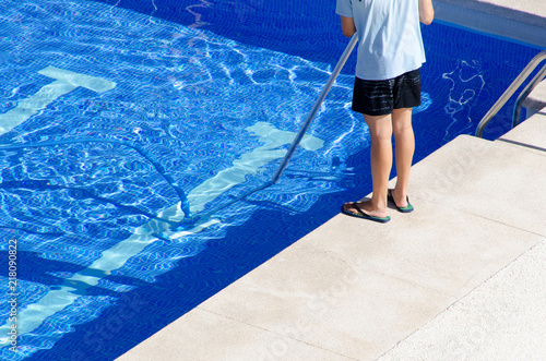cleaning the swimming pool ground