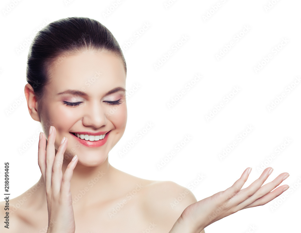 Healthy woman spa model smiling and showing empty copy space on the open hand isolated on white background Healthy woman spa model smiling and showing empty copy space on the open hand isolated on white background