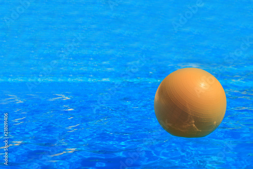 Beach ball on water in pool © Ivan Karpov