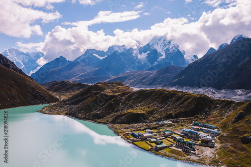 Mountain range with beautiful clouds. Mountain landscape. View on the lake Gokyo Ri. Blue sky with clouds. Himalaya mountains of Nepal, snow covered high peaks and lake not far from Everest.