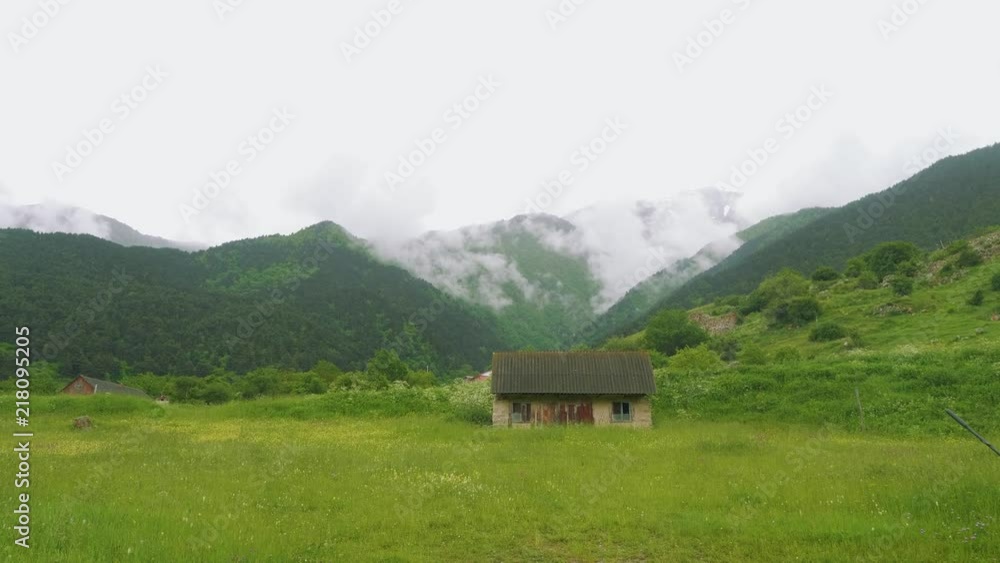 View of old Ossetian family fortress and ruins of houses high in mountains View of old Ossetian family fortress and ruins of houses high in mountains
