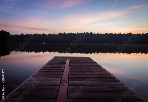 A dock view of on Lake Joseph at dawn.