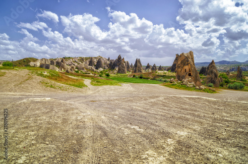 Impressive fungous forms of sandstone and hills in the canyon at Cappadocia, Nevsehir Province, Anatolia Region of Turkey, Asia. Beauty of nature concept background. photo