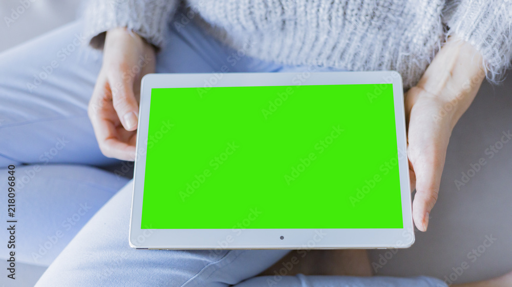 woman is relaxing on comfortable couch and using laptop at home woman is relaxing on comfortable couch and using laptop at home