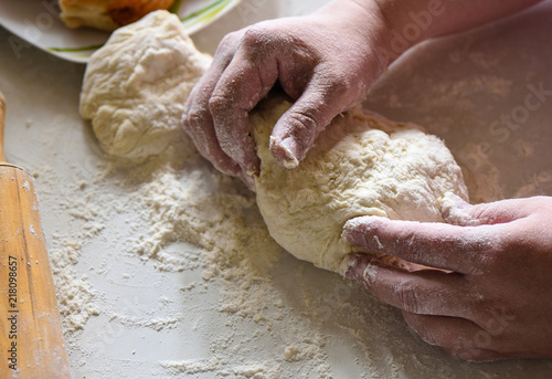 Preparation of flour dough with female hands