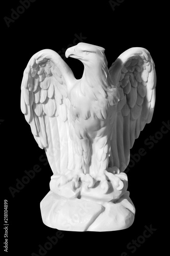 statue of an eagle on a black background