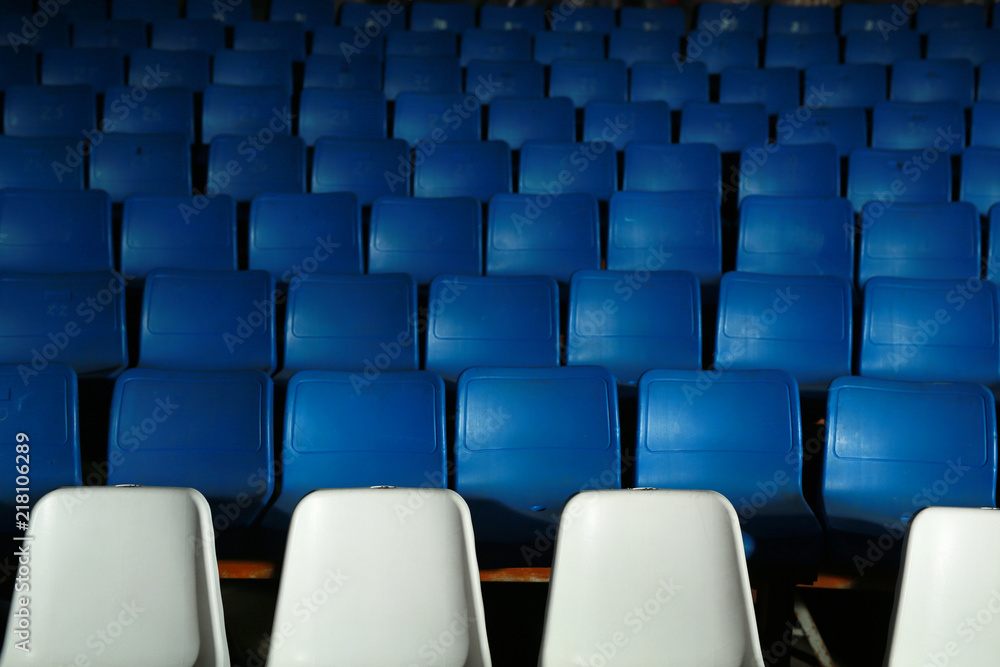 row of chairs in the room for spectators row of chairs in the room for spectators