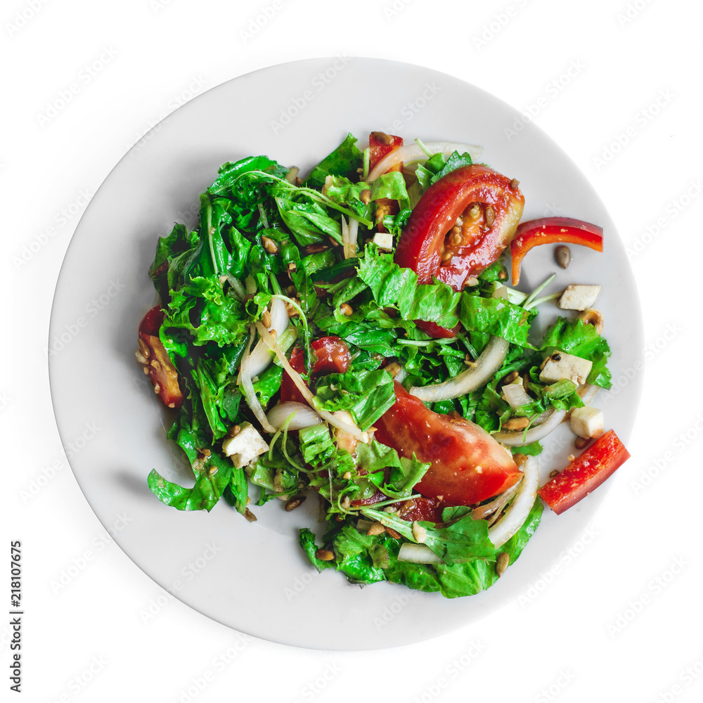 Falf plate fresh salad with tomatoes, nuts, arugula and cheese on white isolated background top view. Healthy food. Vegetarian food Falf plate fresh salad with tomatoes, nuts, arugula and cheese on white isolated background top view. Healthy food. Vegetarian food