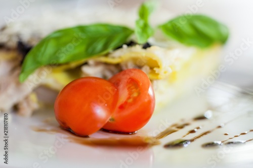 Closeup of Tomatoes on a Plate of Lasagna