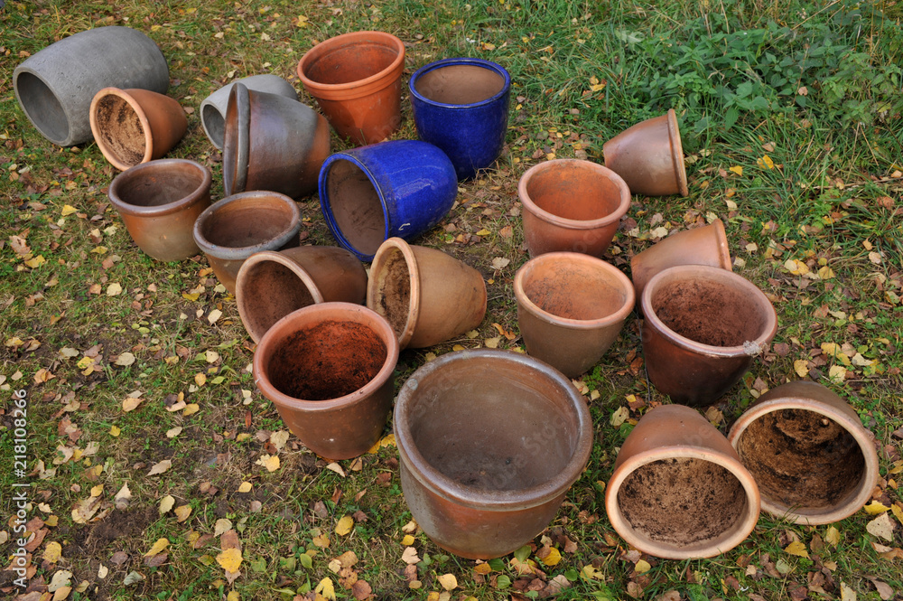 Empty flower pots in the garden. Ready to be stored for the winter.