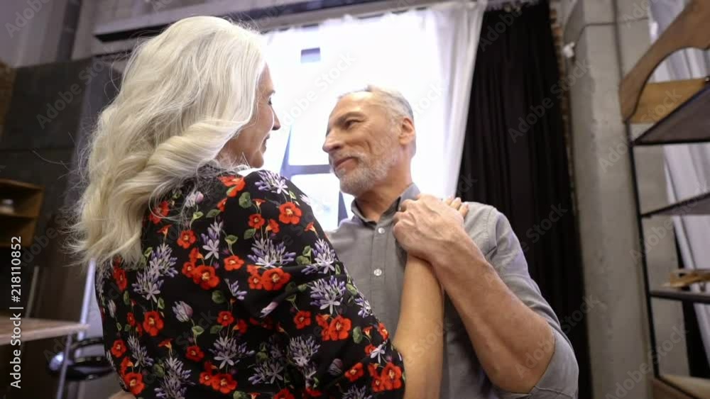 Sensual lovely elderly couple dancing together and enjoys at home Sensual lovely elderly couple dancing together and enjoys at home
