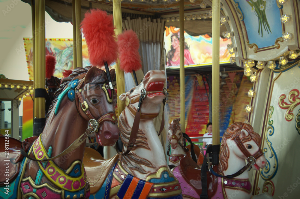 Fototapeta premium Carousel in the amusement Park, children's carousel horses
