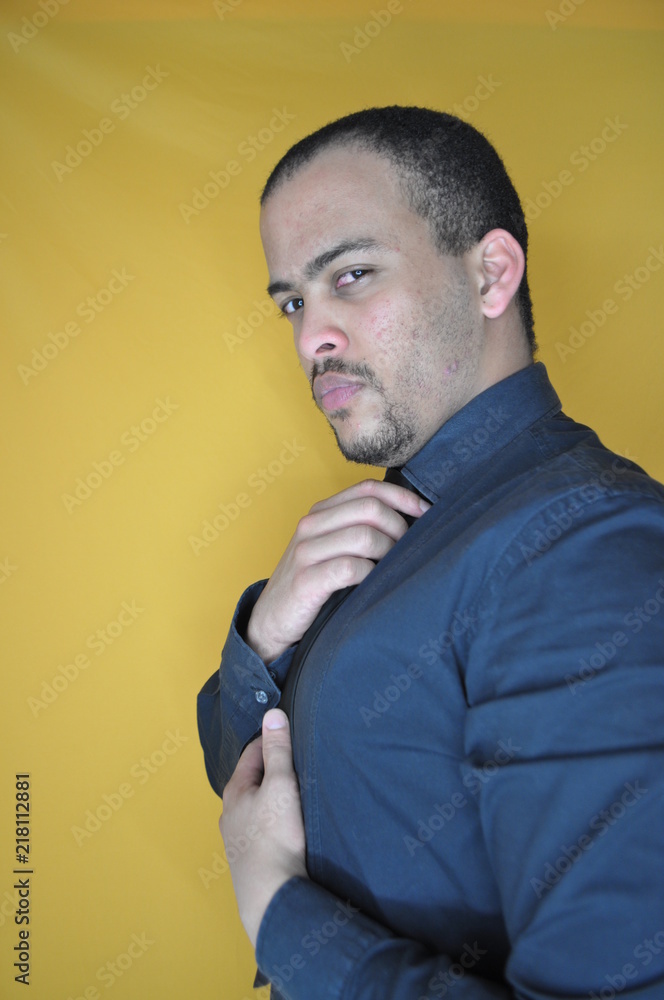 Stoic man adjusting tie Stoic man adjusting tie