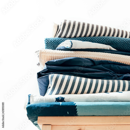 Towels, blankets and other home textile in blue and beidge colors photo