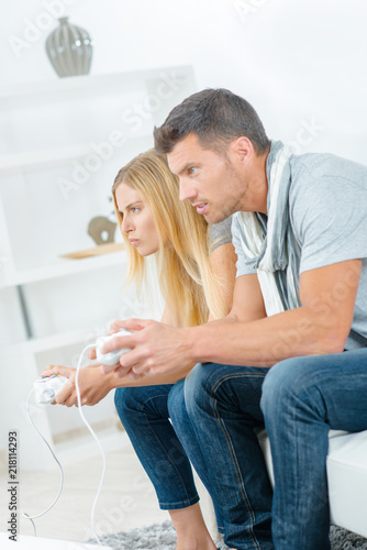 Couple playing video games © auremar