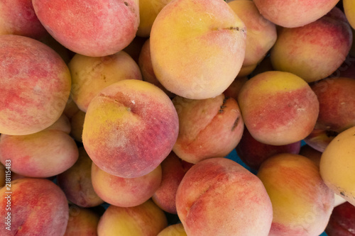 Fresh peach stand at a street organic food market.