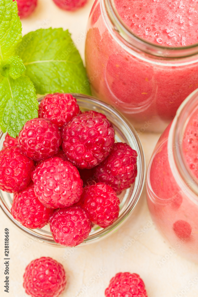 Raspberry smoothie close up photography with fresh summer blended cocktail and ripe berries. Raspberry smoothie close up photography with fresh summer blended cocktail and ripe berries.