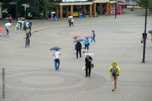 Rain in the town, people with umbrellas. Slovakia photo