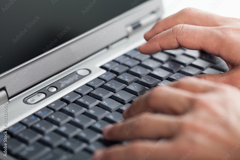 Closeup of a Person Typing on a Laptop Keyboard Closeup of a Person Typing on a Laptop Keyboard