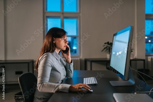 Side view of businesswoman working in the evening.